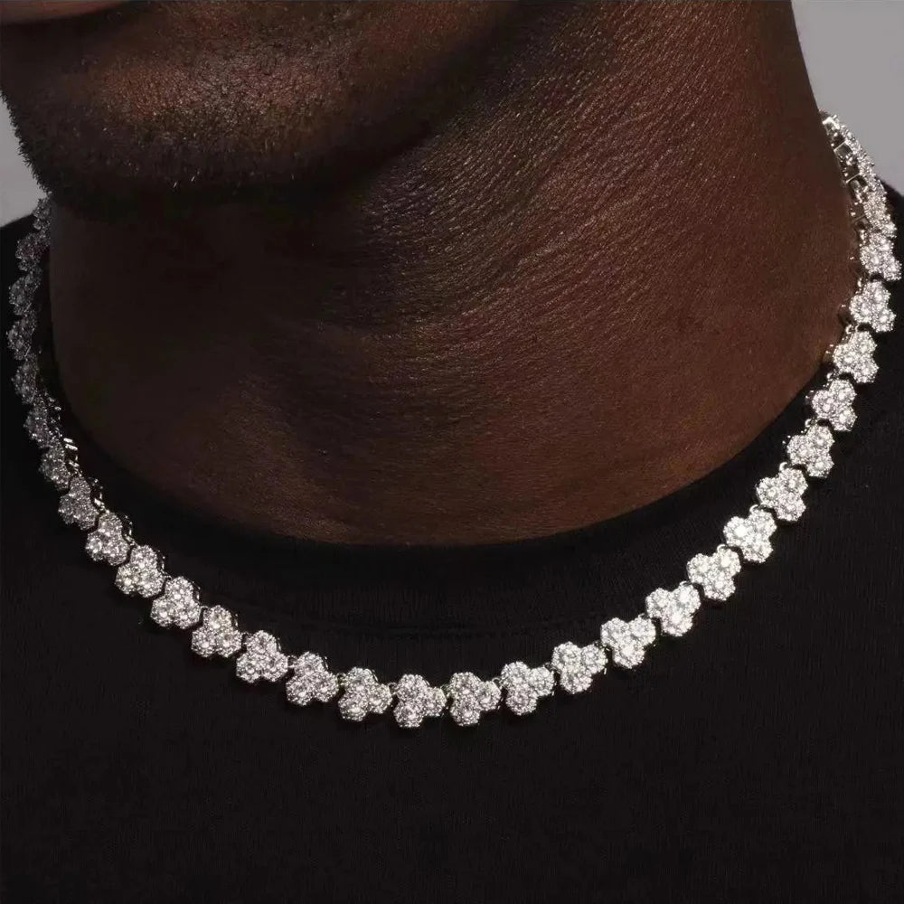 Silver necklace on a person wearing a black shirt