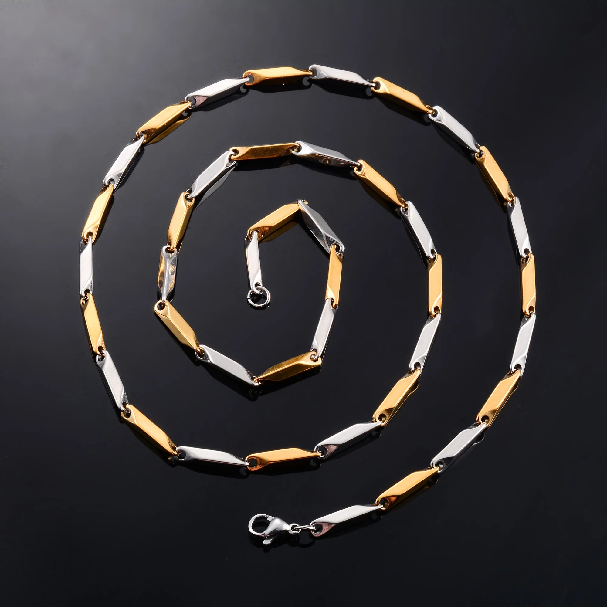 Stainless steel bamboo necklace chain in 2.5mm and 3mm width, unisex fashion jewelry with sleek metal links.