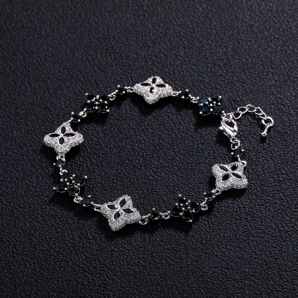 Four-Leaf Clover Bracelet in silver-tone with pavé crystals and black bead accents.