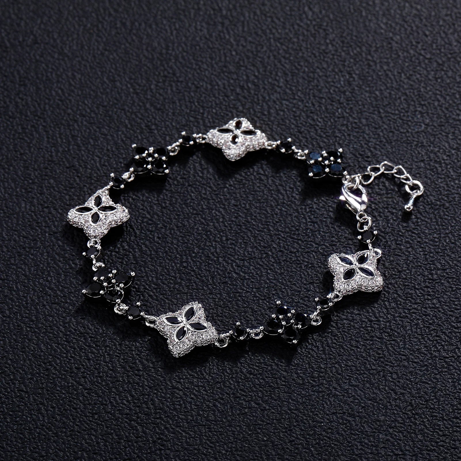 Four-Leaf Clover Bracelet in silver-tone with pavé crystals and black bead accents.