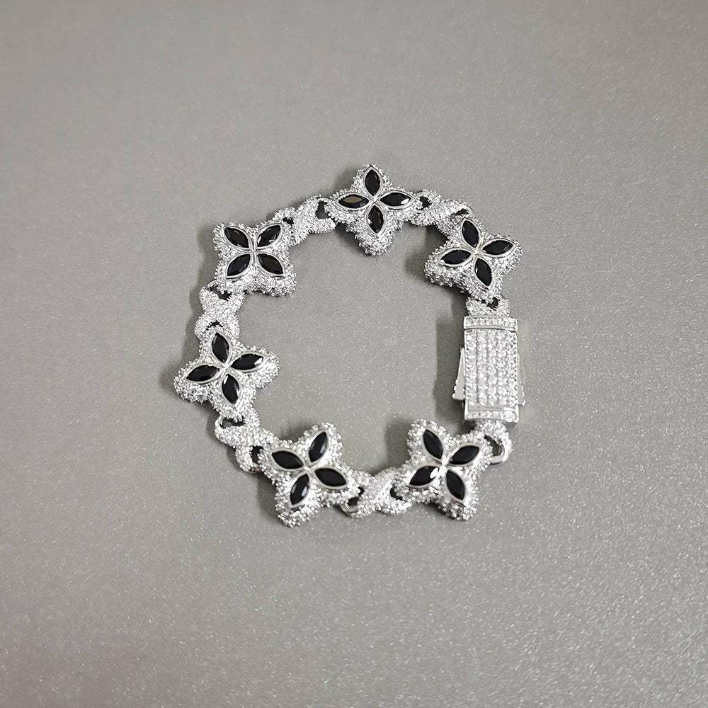 Baby Blue Baguette CZ Bracelet with silver-tone floral links and black accents