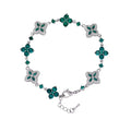 Four-Leaf Clover Bracelet in silver with emerald-green crystals, pavé accents, and adjustable lobster clasp.