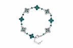 Four-Leaf Clover Bracelet in silver-tone with emerald-green stones and clover motifs, adjustable clasp.