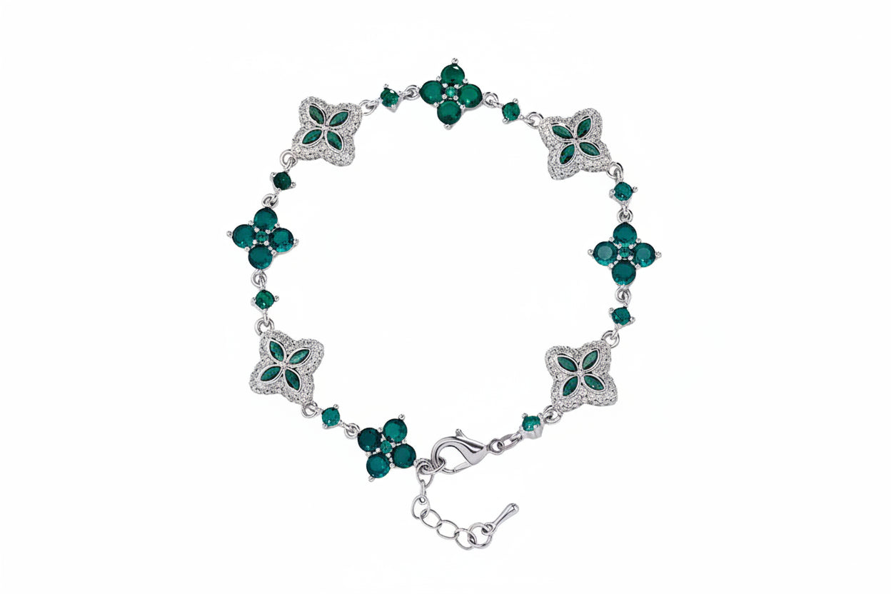 Four-Leaf Clover Bracelet in silver-tone with emerald-green stones and clover motifs, adjustable clasp.