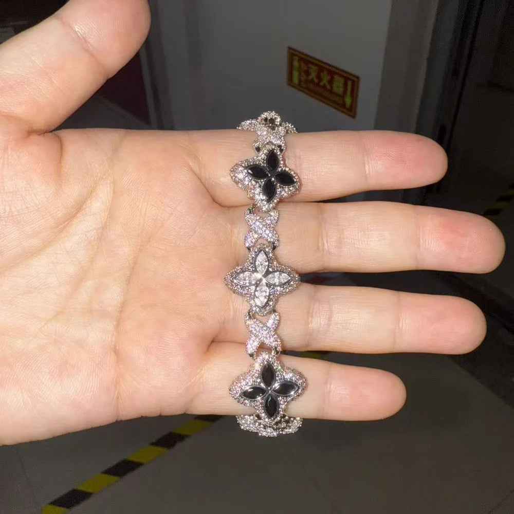 Baby Blue Baguette CZ Bracelet by Soft Paradise with floral links and pave crystals.