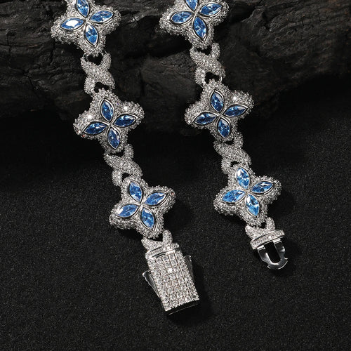 Baby Blue Baguette CZ Bracelet with silver-tone links and flower-shaped blue stone clusters.